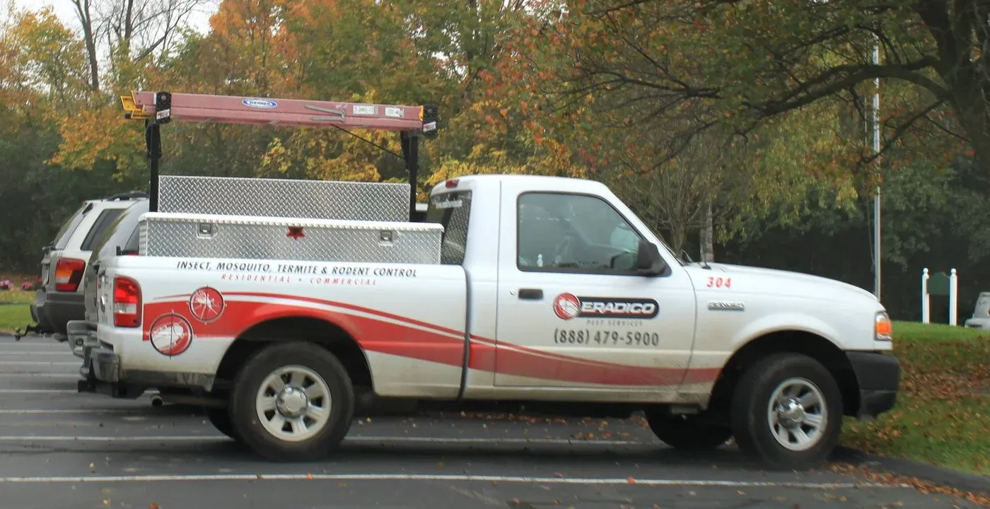 A licensed pest control service vehicle marked for insect, mosquito, termite, and rodent control, illustrating the kind of professional provider a host calls in for either case.