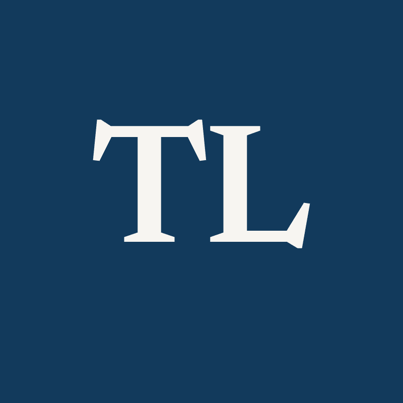 Monogram of the initials TL on navy — Tra Ly has no portrait photograph on the site yet